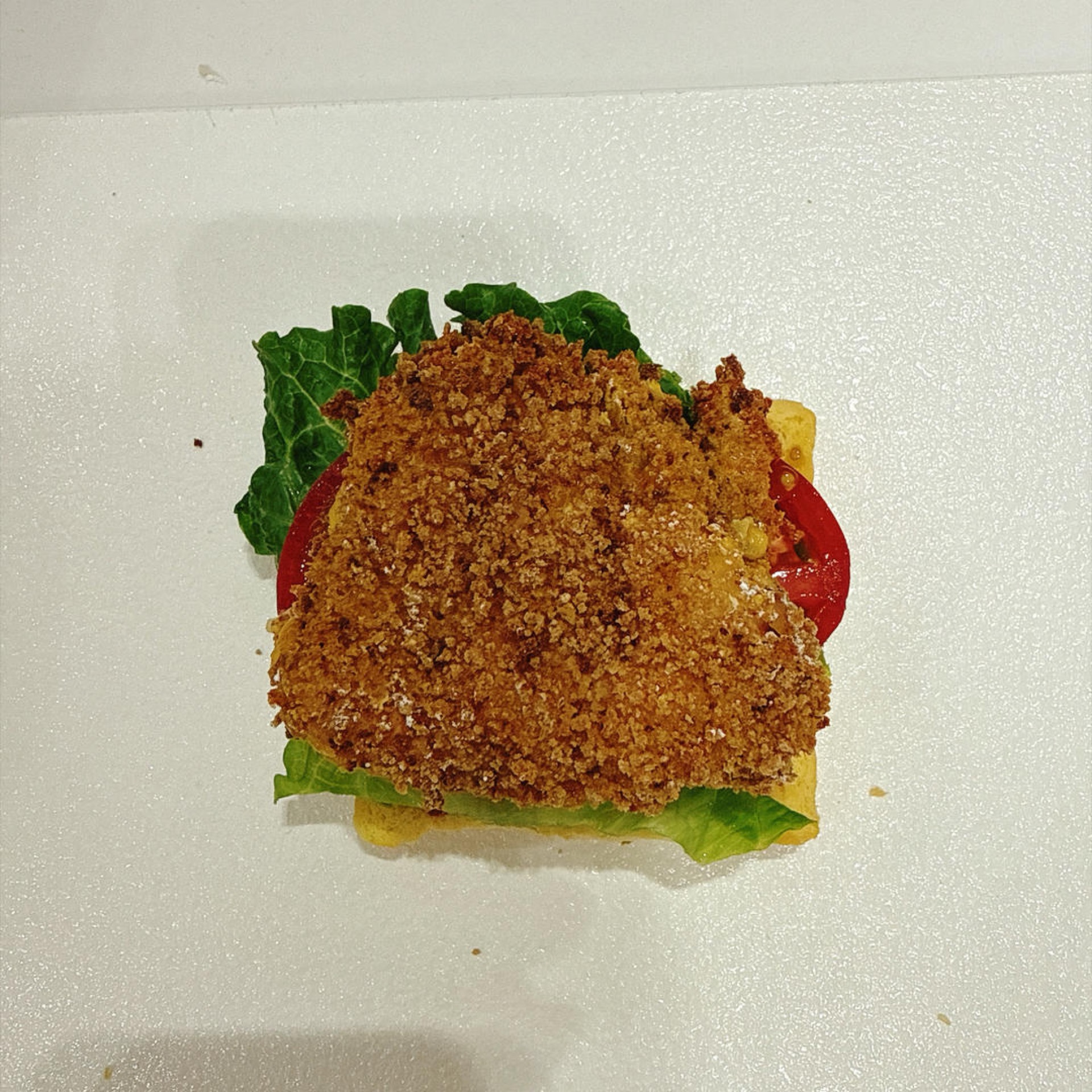Set the crispy cheese-stuffed chicken cutlet on top.