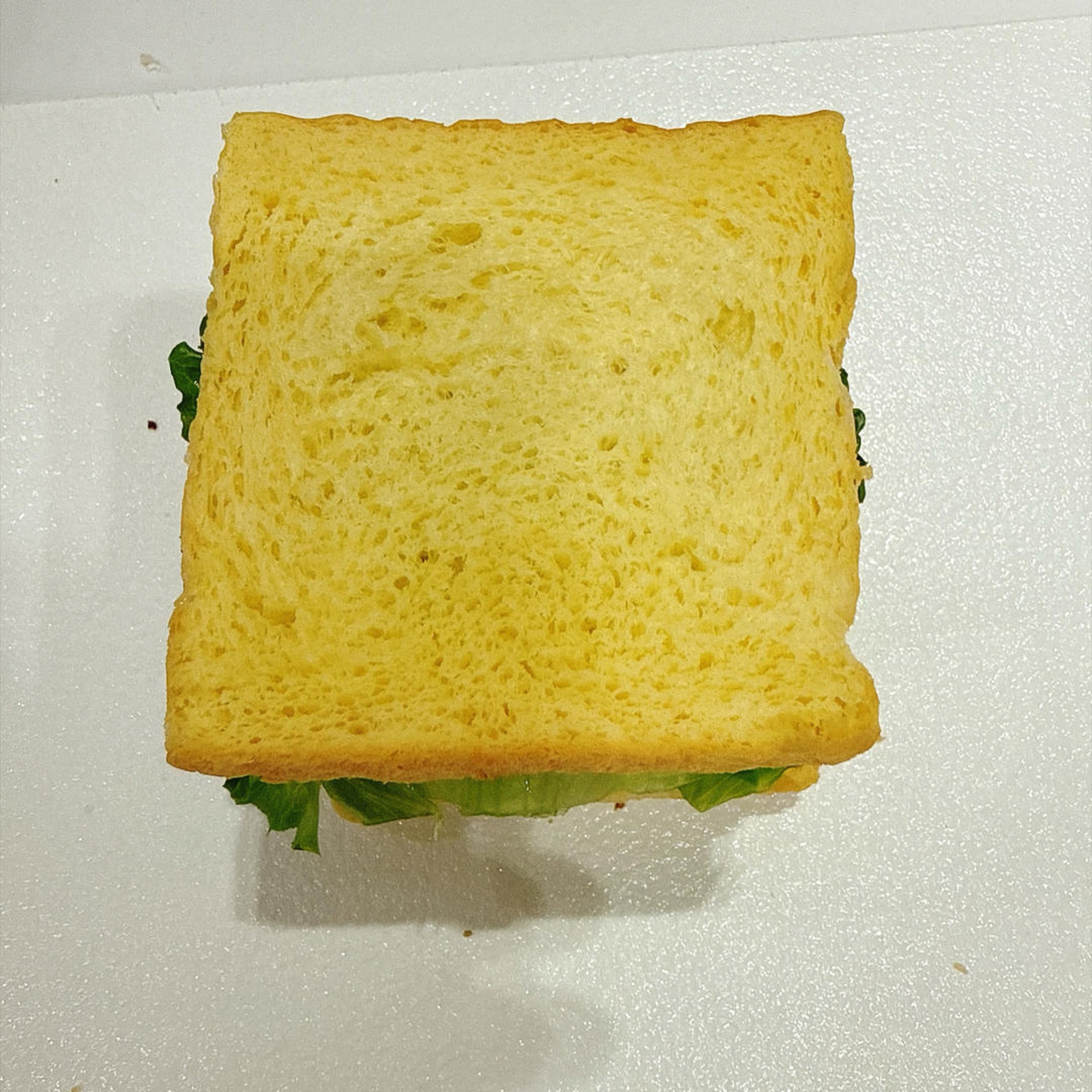 Cover with a second slice of toasted bread.