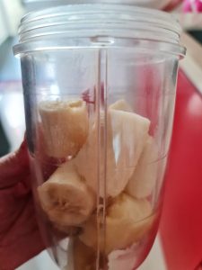Peel the fully ripe bananas, break them into small chunks, and put them into the blender.