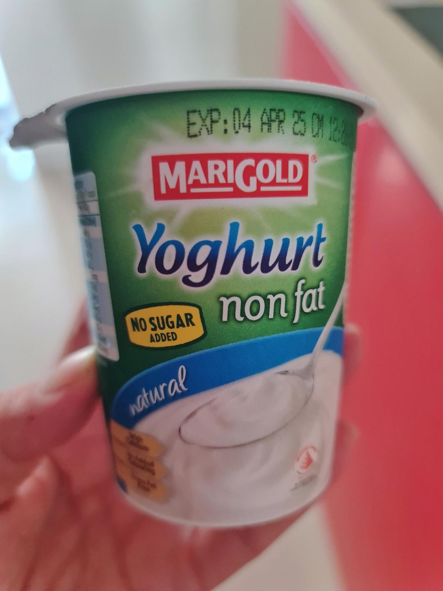 Add the yogurt — mine weighed about 130 g — to the blender with the bananas.
