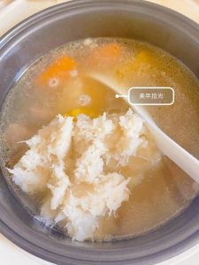 When the time is up, scoop out the yam on its own, mash it with a fork, and stir it back into the soup — no salt is needed, it is rich and delicious, though you can add a little sa