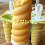 Cream cheese ice cream popsicles on a plate
