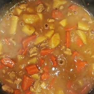 When the sauce is thick and glossy, take the wok off the heat; for a creamier finish stir in milk at the very end without a long boil.