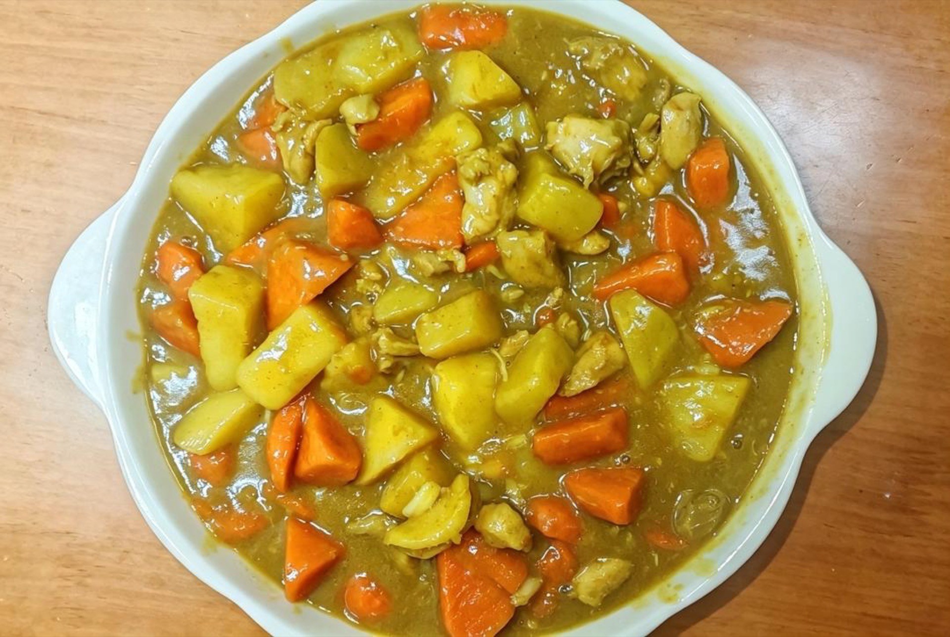 Serve hot—the chicken is tender and silky, the potatoes have drunk up the curry sauce and turned velvety, and the carrots bring their own gentle sweetness.