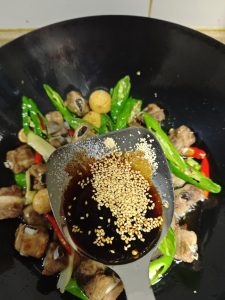 Add the seasonings: sesame seeds, chicken bouillon, oyster sauce, light soy sauce, and salt.