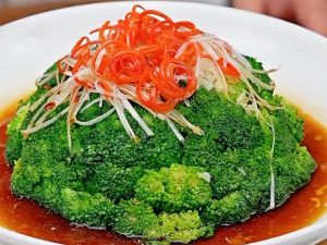 Pour in the sauce and stir-fry fast until it thickens and clings glossily to the broccoli, then serve immediately.