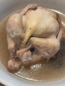 Leave the lid slightly ajar and simmer on low. A small young chicken needs about 45–60 minutes; two need about 70–90 minutes. The chicken should be cooked through and tender and th
