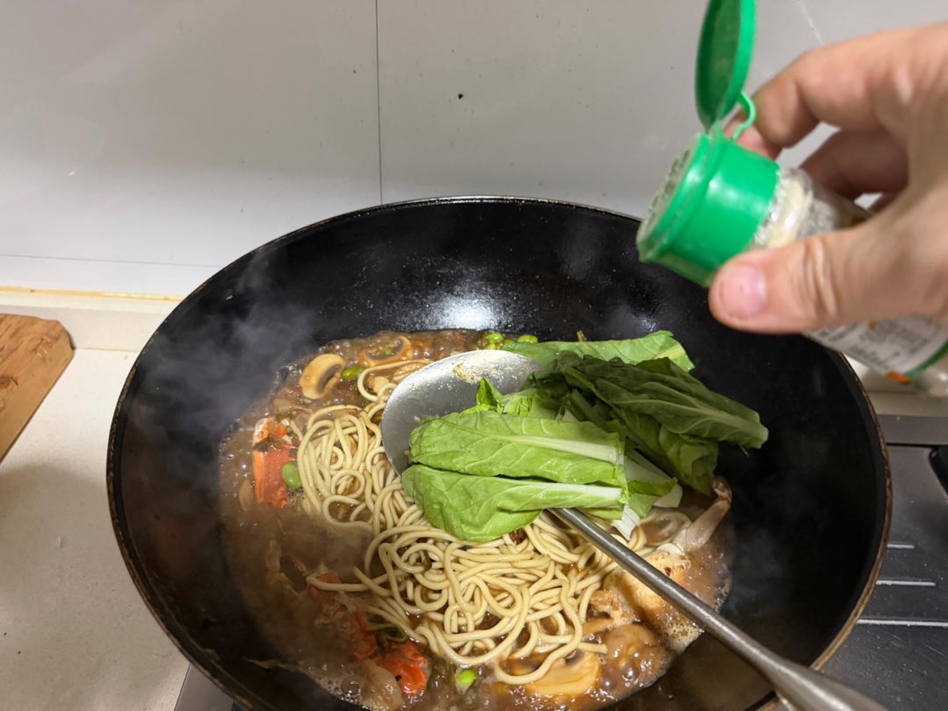 Add the leafy greens and the soul seasoning — 1 g of white pepper.