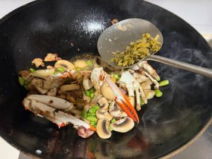 Add just a little snow vegetable to lift the flavor — snow vegetable is the old Zhejiang way of making MSG. The sweetness of swimming crab comes from its mix of glutamate and inosi