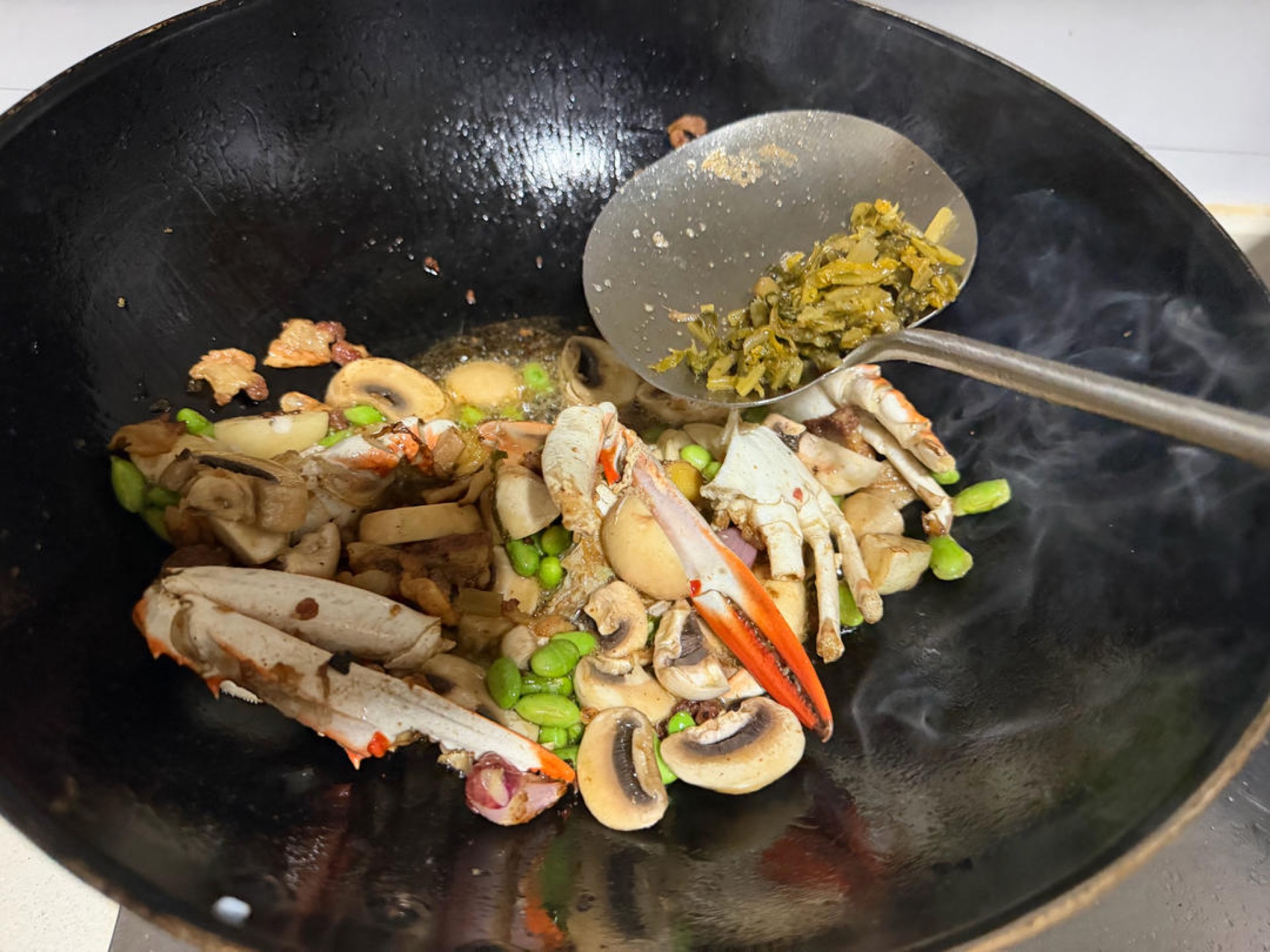 Add just a little snow vegetable to lift the flavor — snow vegetable is the old Zhejiang way of making MSG. The sweetness of swimming crab comes from its mix of glutamate and inosi