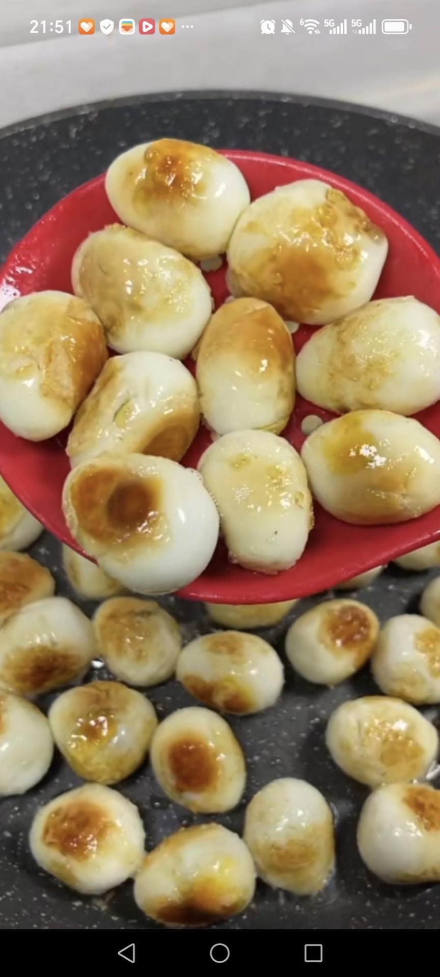 Fry the quail eggs in hot oil until golden.