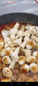 Add the tofu skin and quail eggs. Add the chicken bouillon, sugar, and white pepper. Stir to combine evenly.