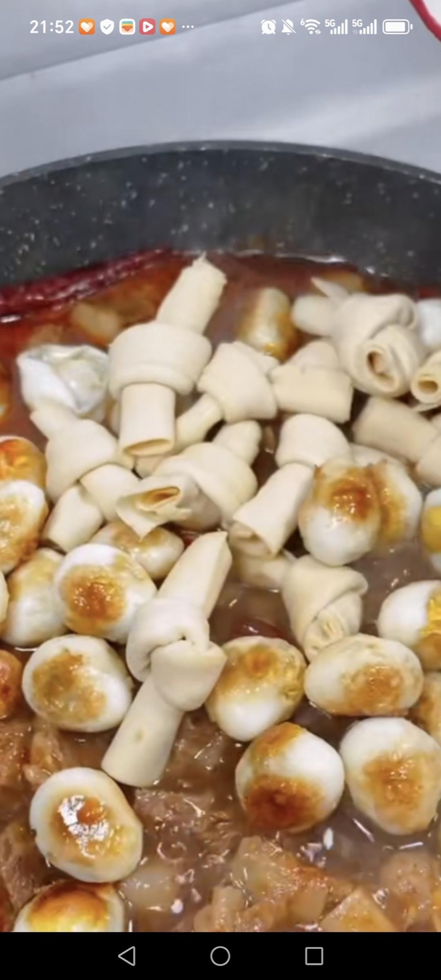 Add the tofu skin and quail eggs. Add the chicken bouillon, sugar, and white pepper. Stir to combine evenly.
