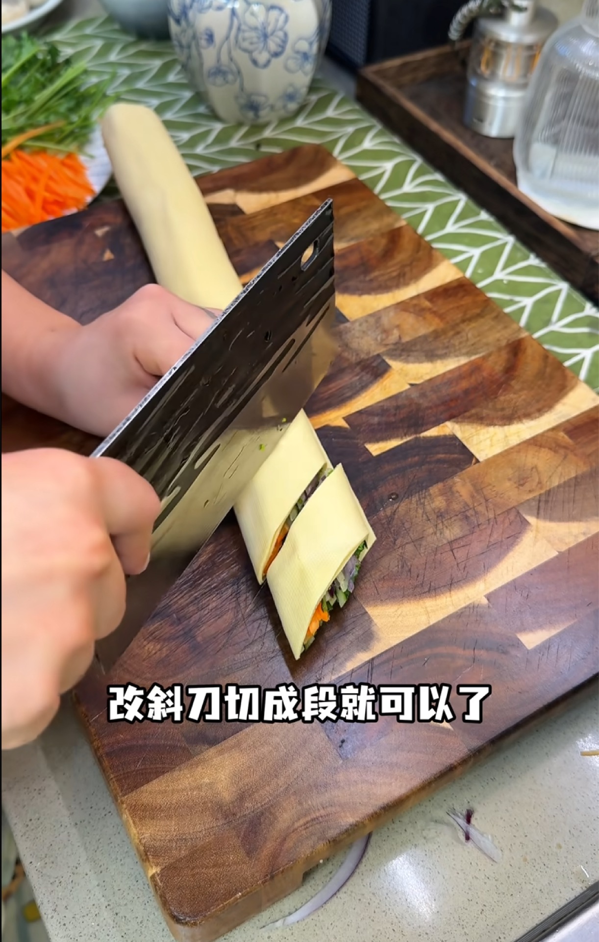 Cut the roll on a sharp diagonal into segments, then arrange them in a ring around the outer edge of a serving plate.
