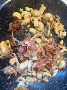 Scatter in the Parma ham and stir-fry for 1 minute so it warms through and flavors the mushrooms.
