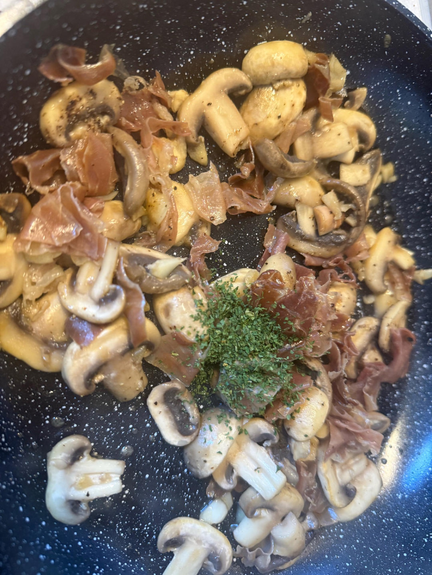 Add the salt, black pepper, and chopped parsley, and toss everything together until evenly coated.