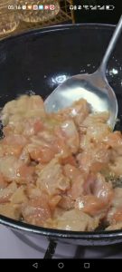 Heat a wok over high heat, add 1 tablespoon oil, and slide in the chicken in a single layer.