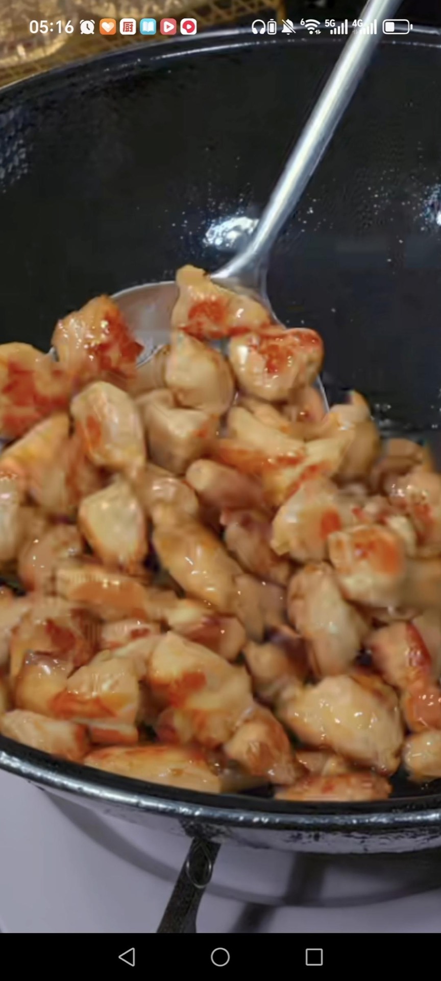 Stir fry the chicken 3 to 4 minutes until golden at the edges and cooked through, then scoop it out with a slotted spoon and set aside.