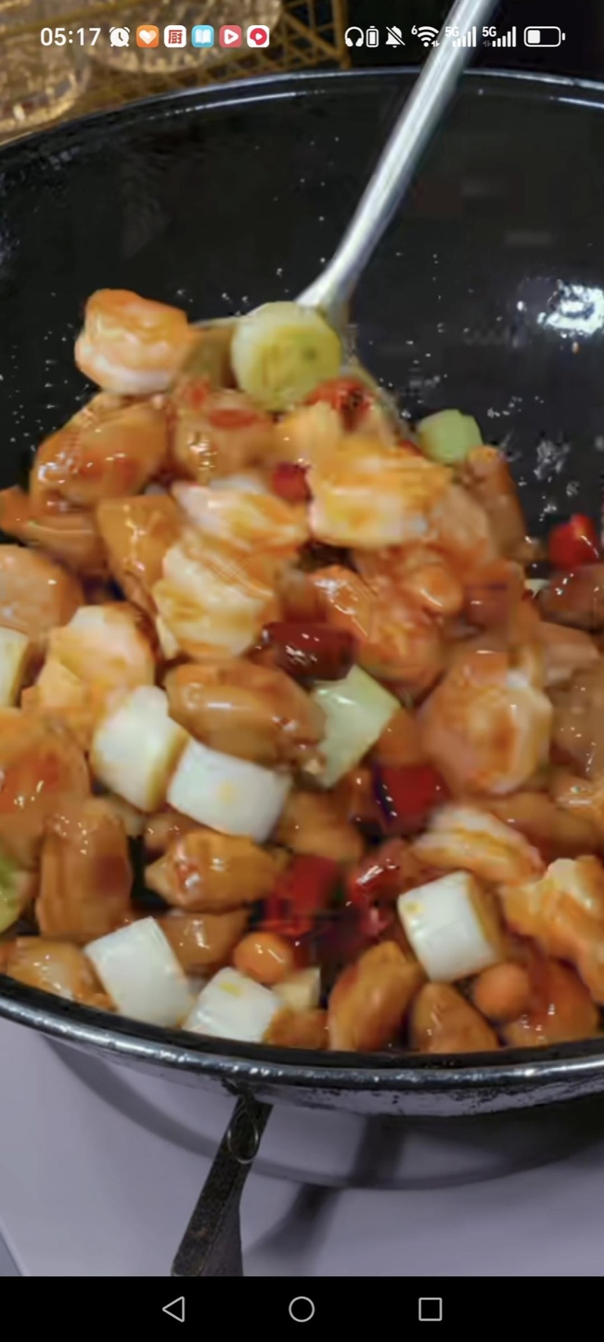 Pour in the sauce, stir fry 30 to 45 seconds until it thickens into a glossy coat, then finish with 1 tablespoon chili oil, toss once more, and turn off the heat.
