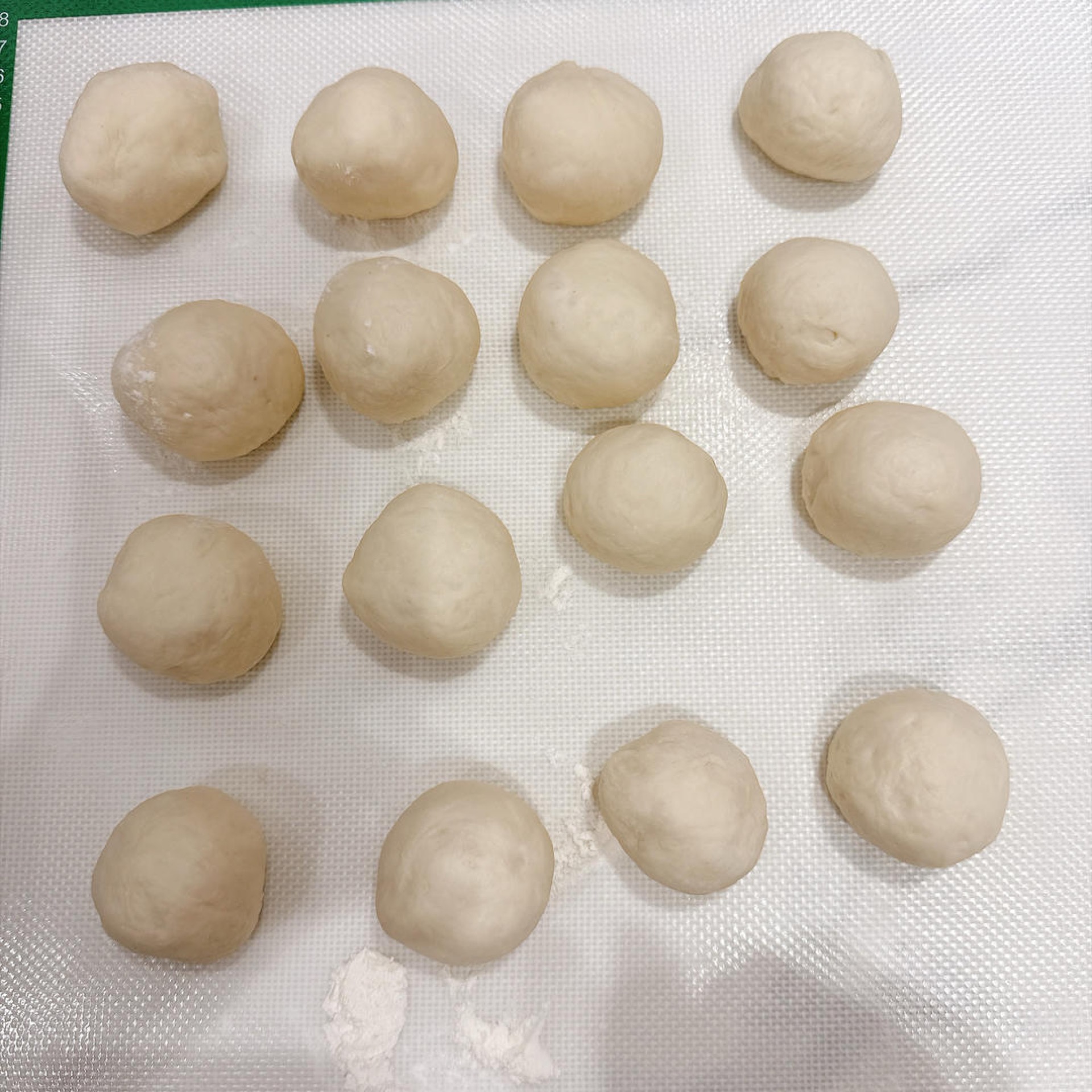Round each portion into a ball, cover them, and let them rest for 15-20 minutes.