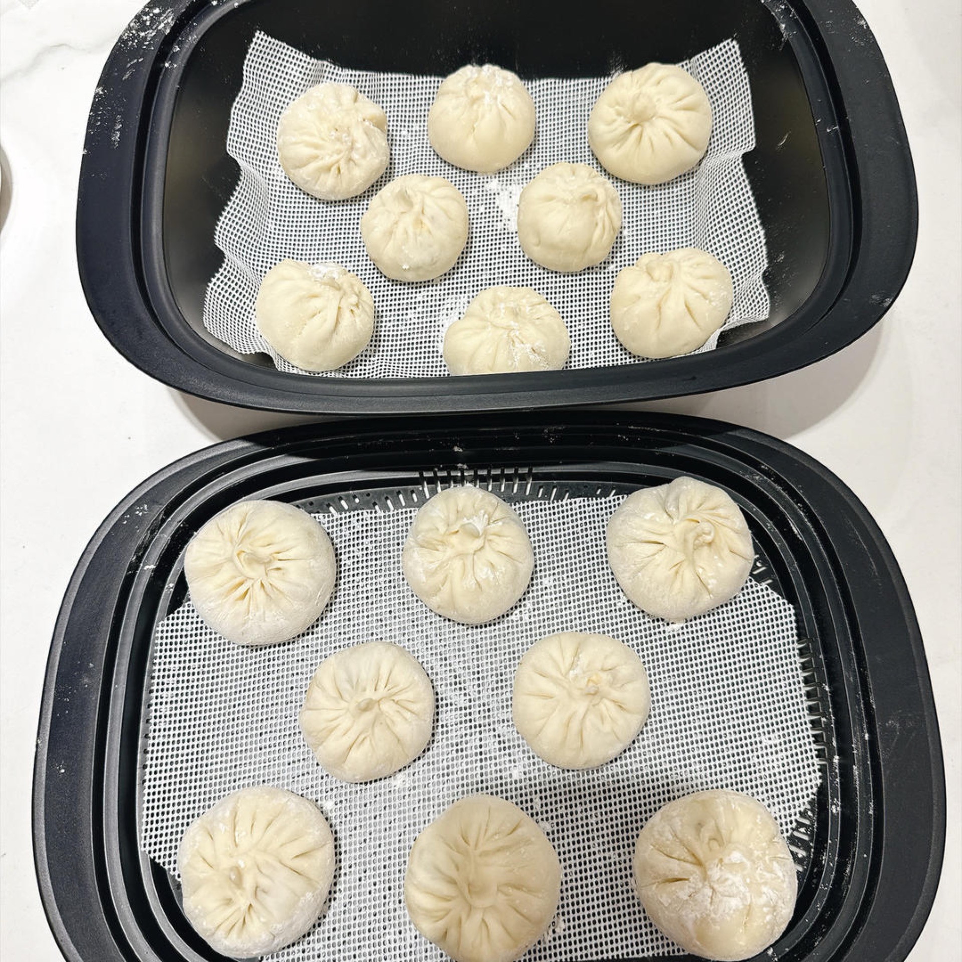 Place them on a steaming tray lined with baking paper and into the steamer.