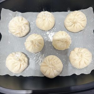 Cover the steamer with its lid and let the buns proof for 20 minutes.