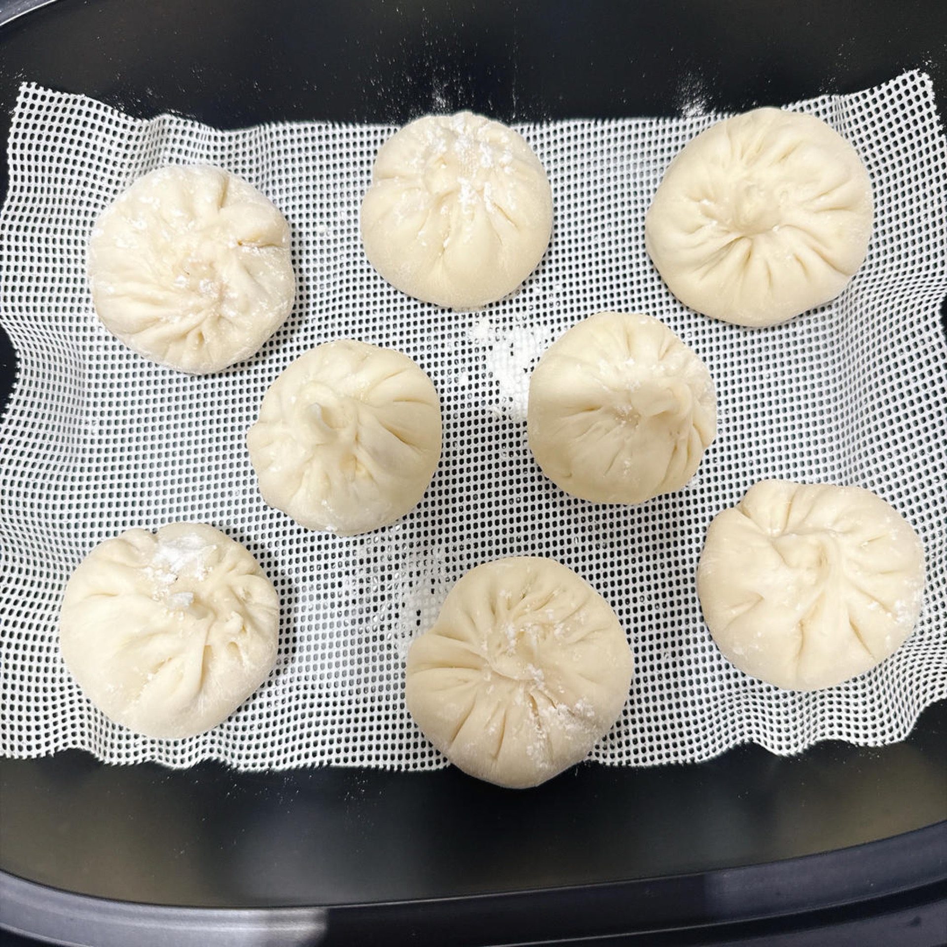 Cover the steamer with its lid and let the buns proof for 20 minutes.
