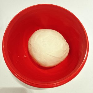 Take the dough out, round it into a ball and place it in a large bowl. The kneading mode makes it easy to work the dough until it is smooth and fine.