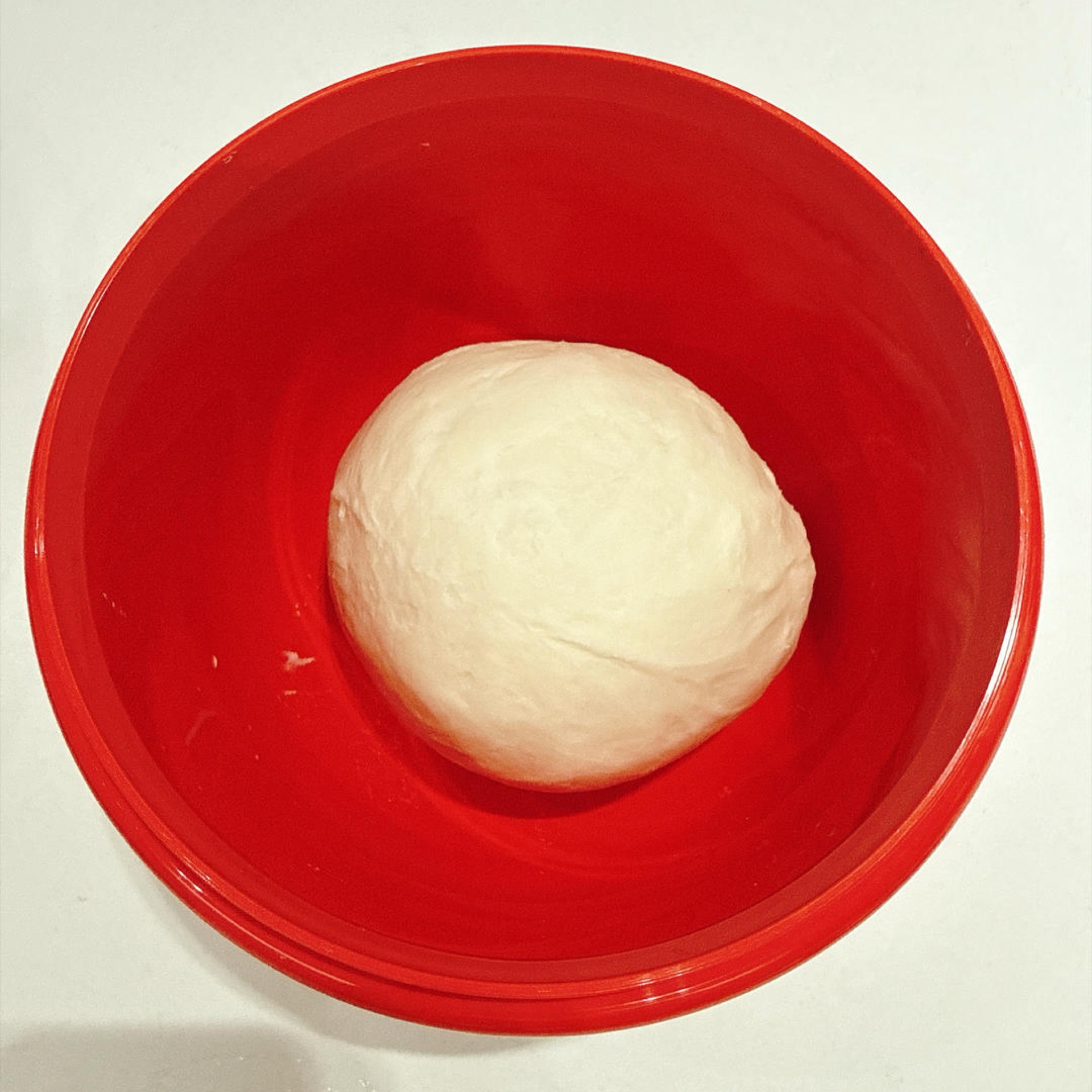 Take the dough out, round it into a ball and place it in a large bowl. The kneading mode makes it easy to work the dough until it is smooth and fine.
