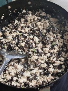 In a large bowl, combine the flour and yeast. Gradually add warm water and mix until a shaggy dough forms. Knead until smooth, cover, and let rise in a warm place until doubled in