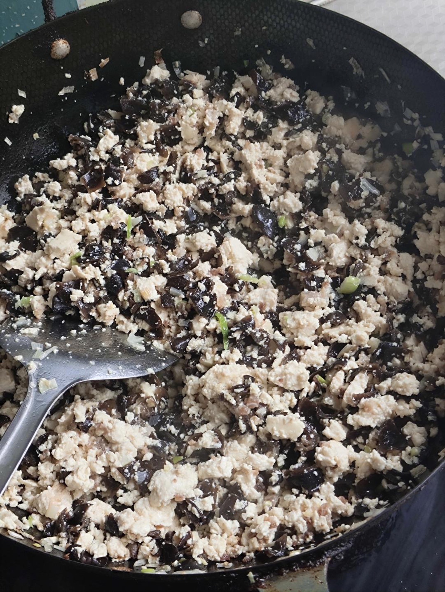 In a large bowl, combine the flour and yeast. Gradually add warm water and mix until a shaggy dough forms. Knead until smooth, cover, and let rise in a warm place until doubled in