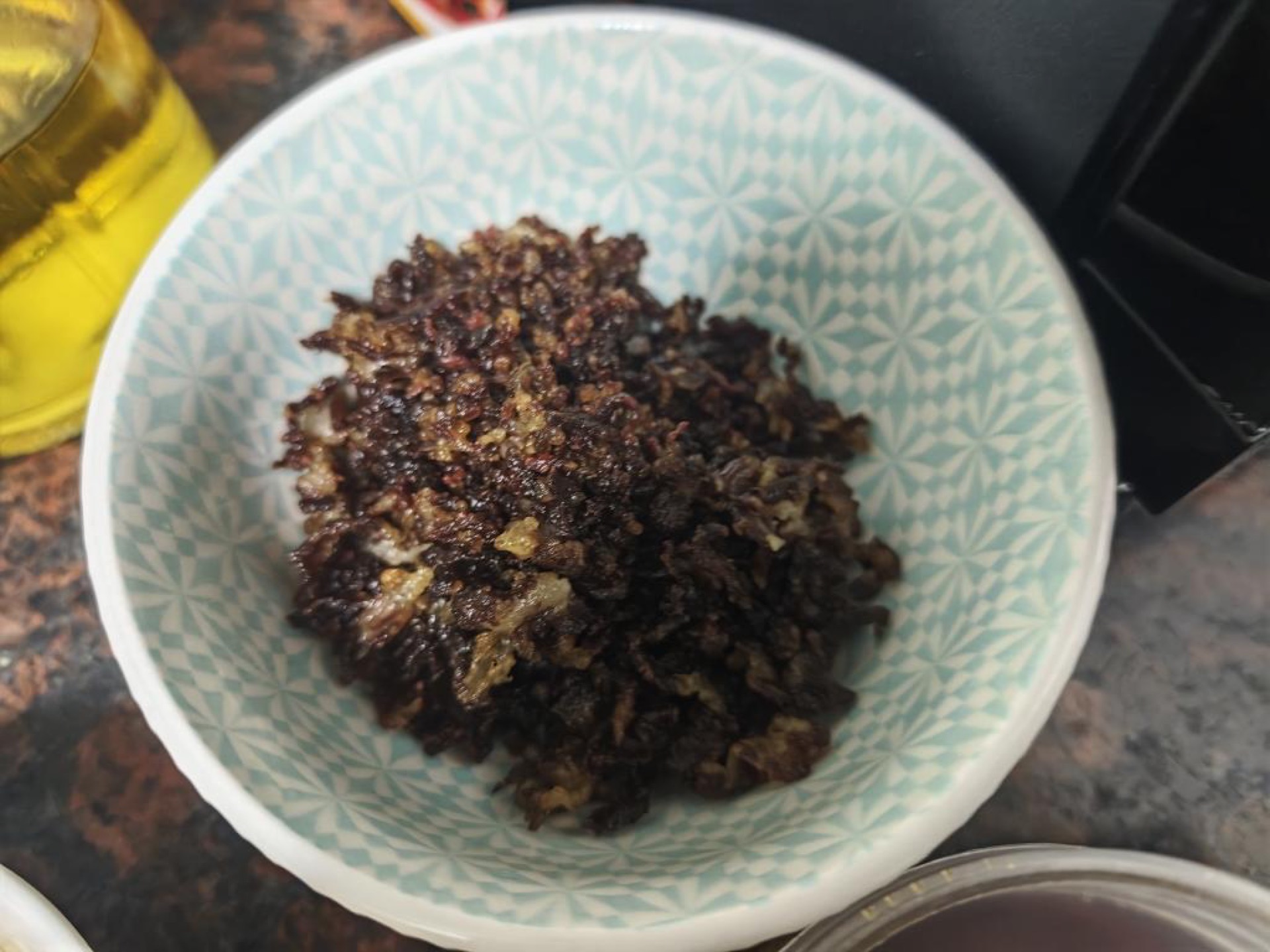 Chop the fatty beef into a coarse mince, then fry it in the wok over medium heat until the bits are dry, rust-colored, and crisp, about 6 to 8 minutes, and scoop them out.