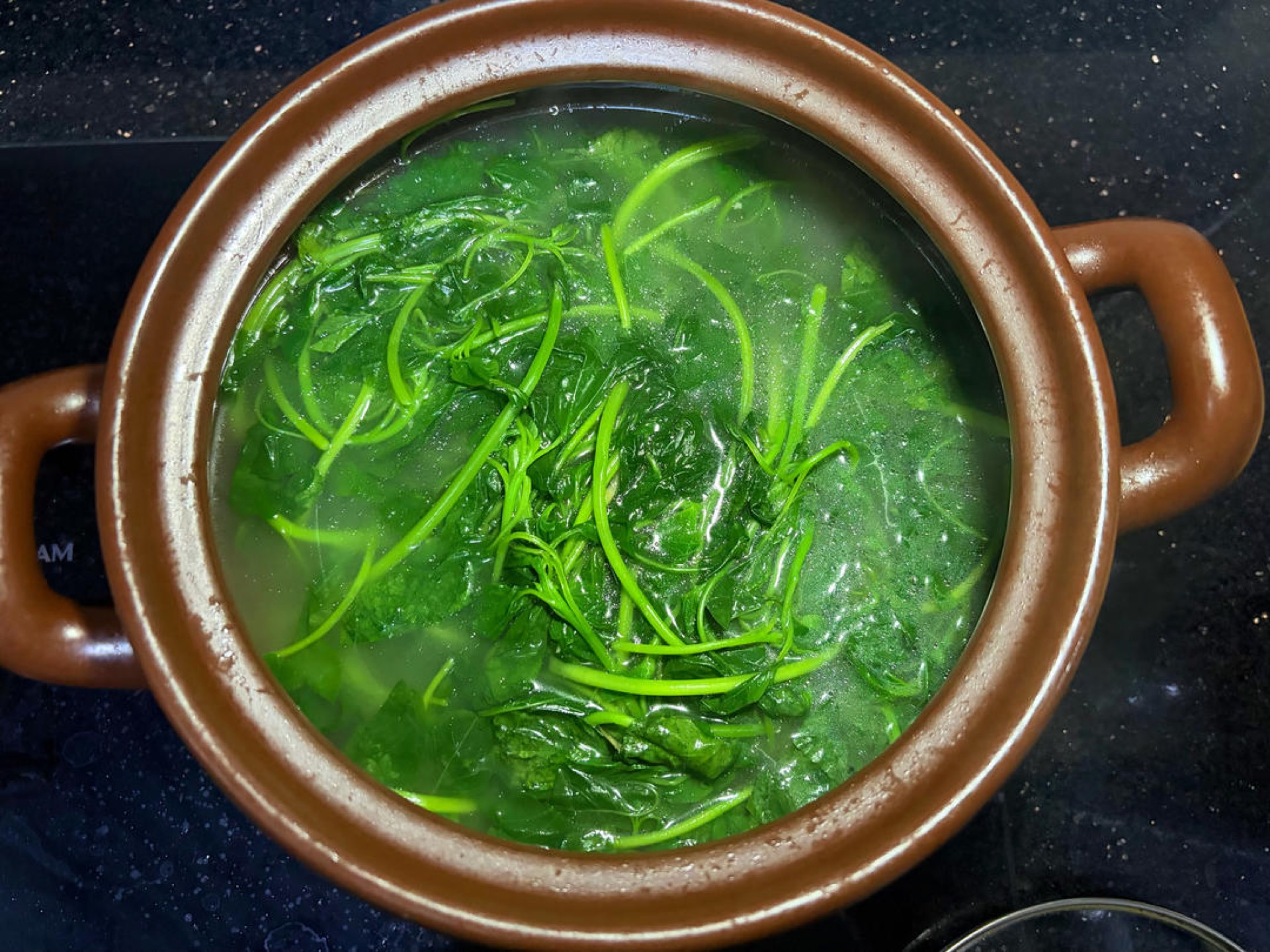 Add amaranth greens and simmer about 1 minute before serving — greens blanched in rib broth make both the vegetable and the soup sweet and fresh.