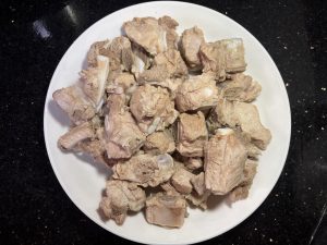 Wash the blanched ribs several times in warm water until every trace of surface foam is gone.