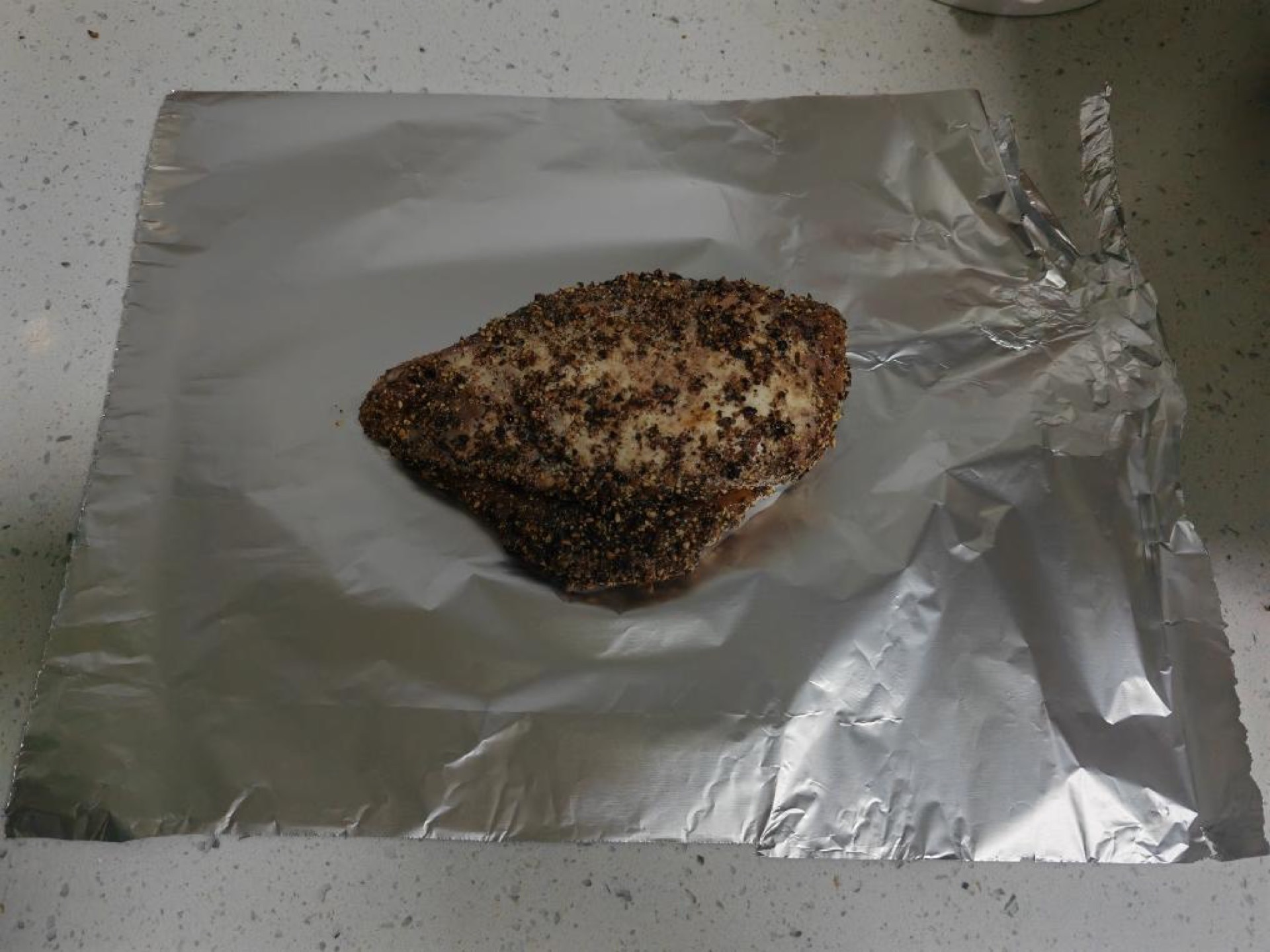 Wrap each seared chicken breast tightly in aluminum foil.