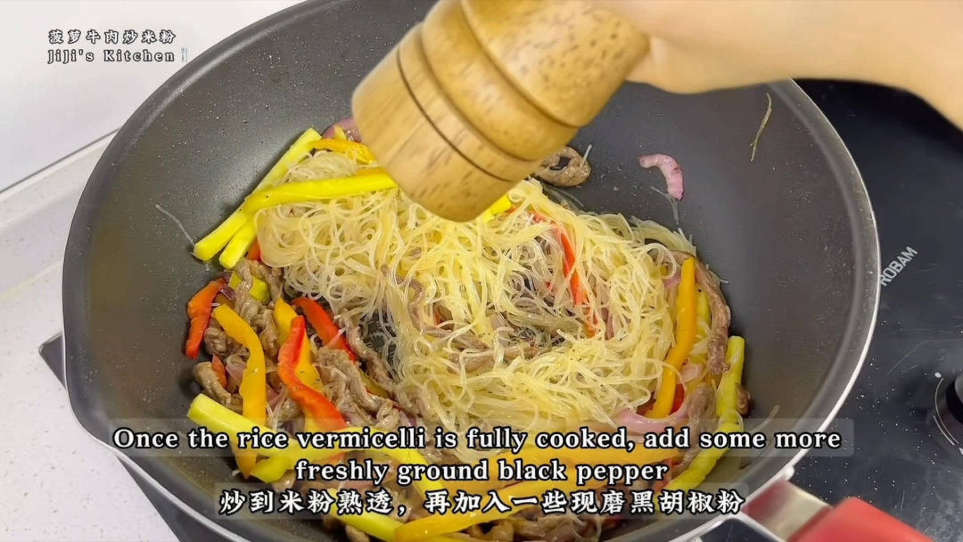 Stir-fry until the rice noodles are fully cooked, then add a little more freshly ground black pepper, toss everything evenly, and take it out of the wok.