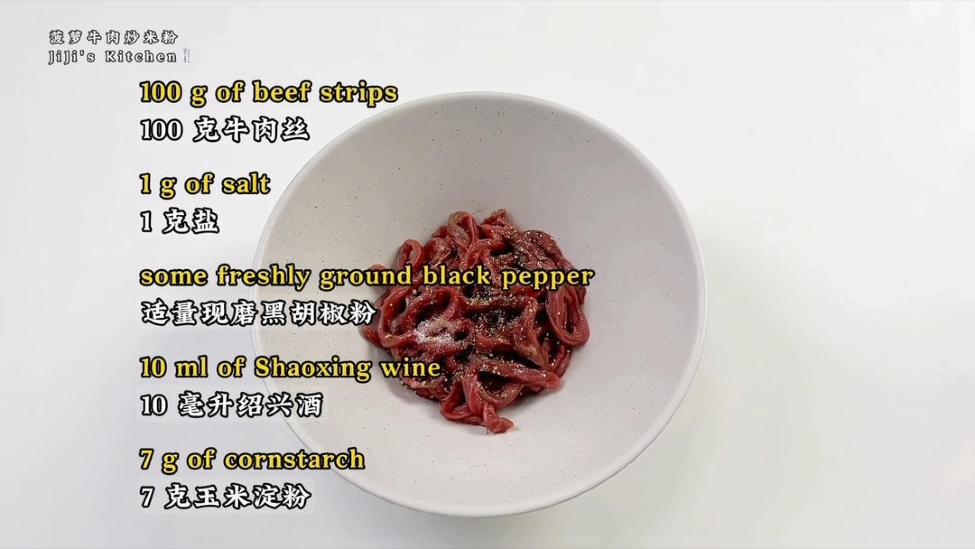 Add salt, freshly ground black pepper, Shaoxing wine, and cornstarch to the sliced beef, then mix with your hand until every strand is coated.
