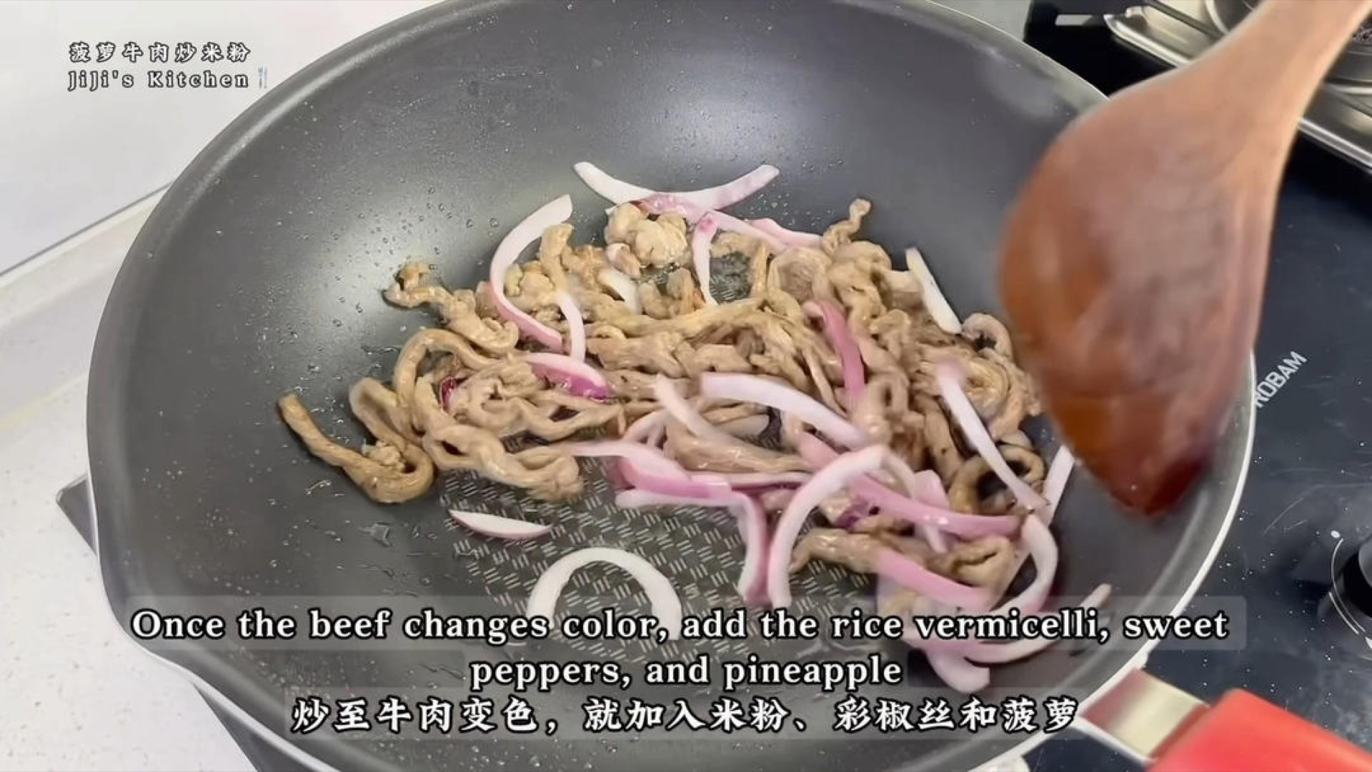 Add the marinated beef strips and stir-fry quickly until the beef changes color.