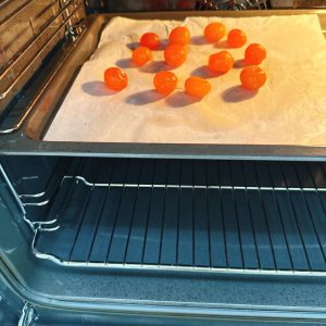 Preheat the oven to 350°F (180°C) and place the 12 salted duck egg yolks on a baking tray, then roast them at 350°F (180°C) for about 15 minutes.