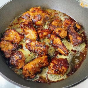 Keep frying until the ribs are cooked all the way through.