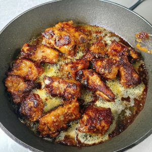 The color should be glossy and red, and the edges should already have that crisp, caramelized texture that looks so appetizing.