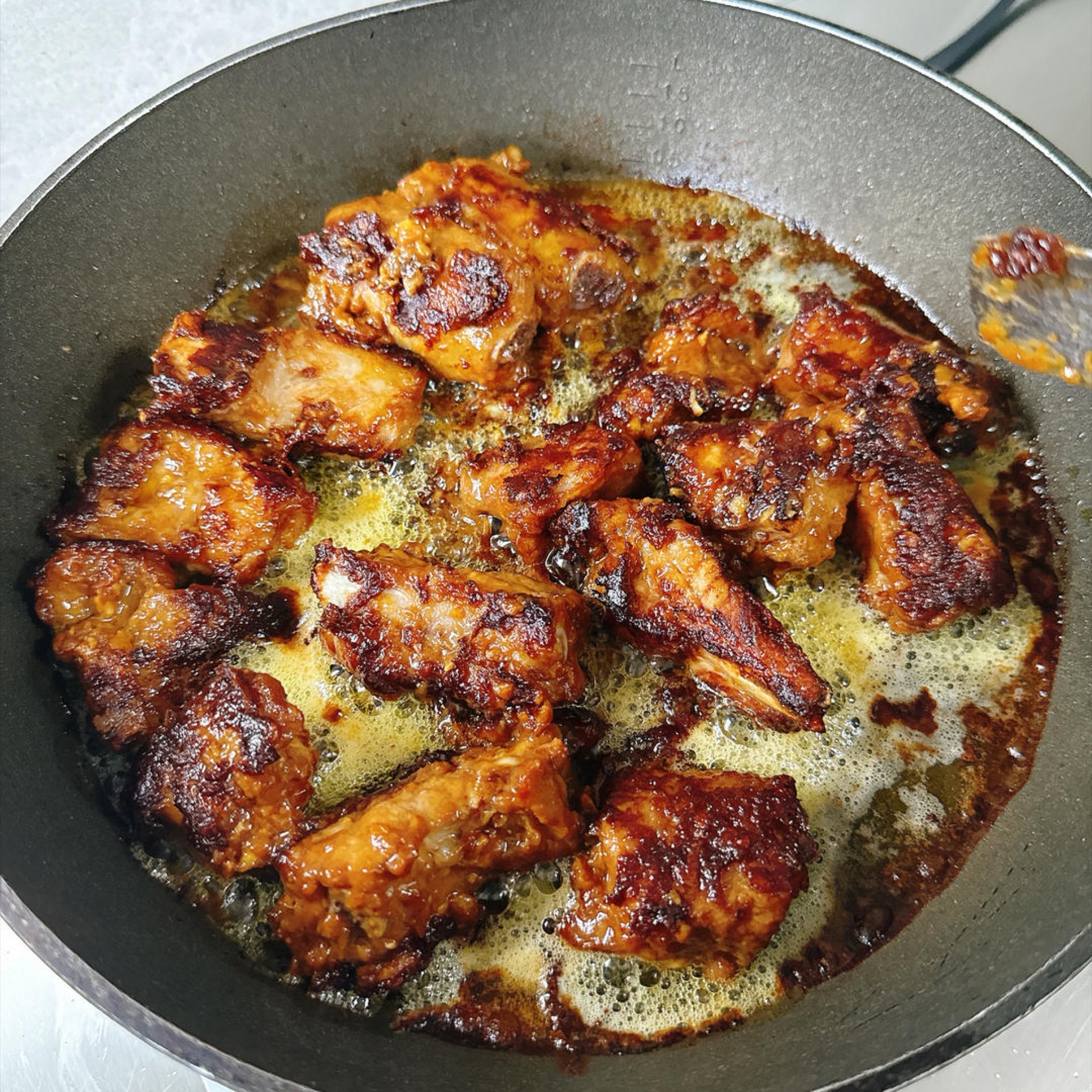 The color should be glossy and red, and the edges should already have that crisp, caramelized texture that looks so appetizing.