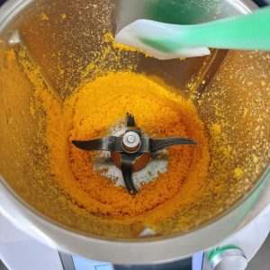 Use a spatula to scrape the ingredients down to the bottom of the main pot.