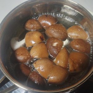 Once the water comes to a boil, add the shiitake mushrooms and blanch for about 2 minutes, then drain.