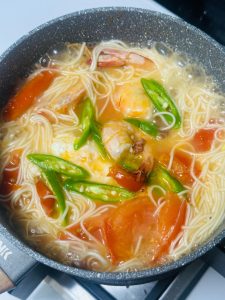 Add the chili segments and simmer briefly.
