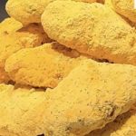 Snow cheese chicken wings coated in snowy cheese powder on a plate