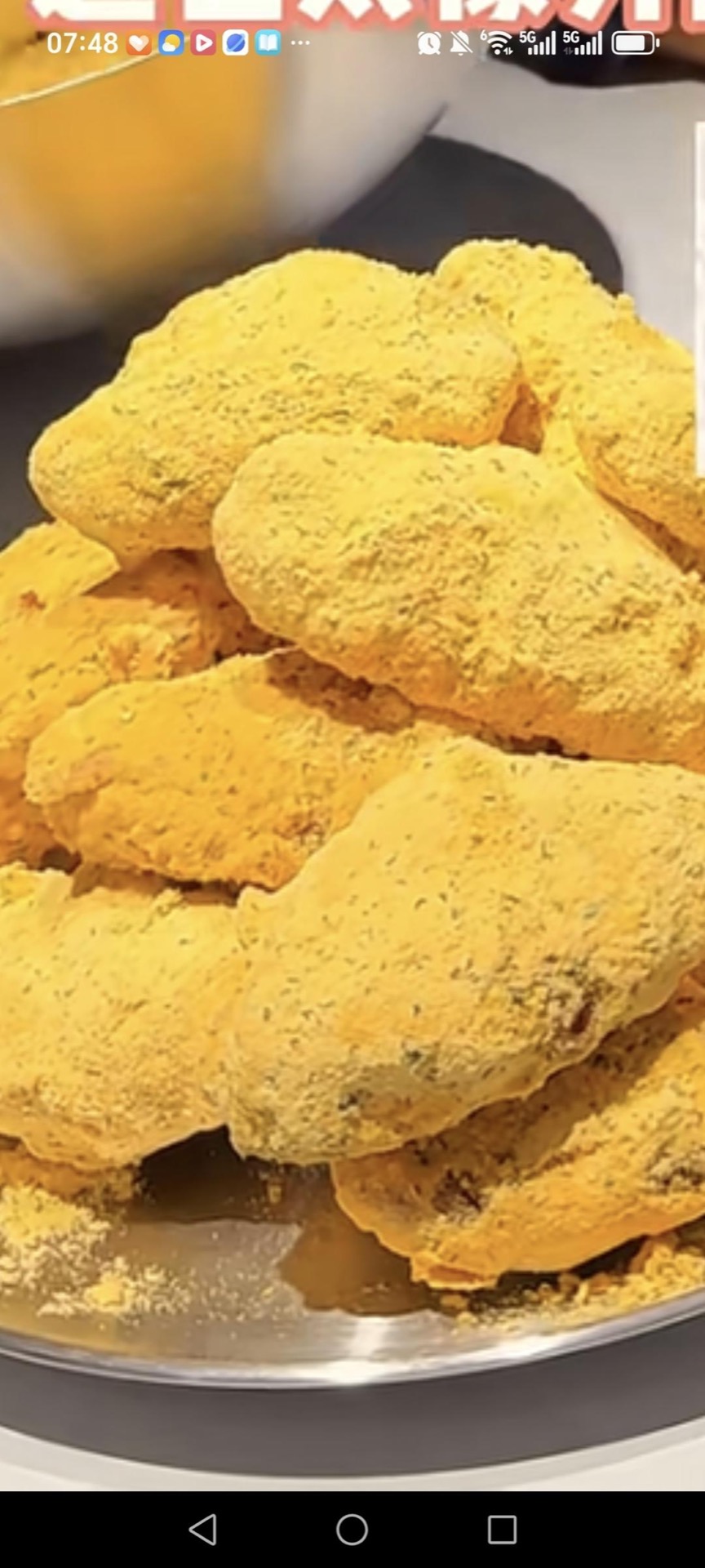 Snow cheese chicken wings coated in snowy cheese powder on a plate