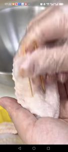 Prick both sides of each chicken wing with a toothpick so the marinade can penetrate and the wings cook evenly.
