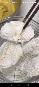 The wings should look dry and fully coated with the crispy coating mix, with no wet patches showing.
