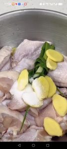 Add the scallions, ginger, salt, and white pepper to the wings and massage everything together with your hands until the pieces feel sticky.